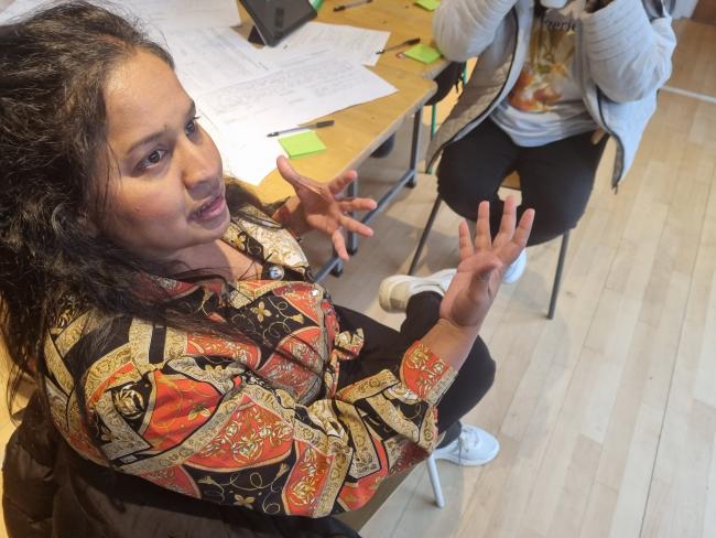 A volunteer sharing her story in a training session in Liverpool