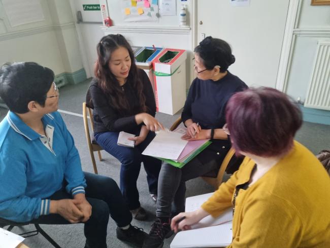 Volunteers discussing the process